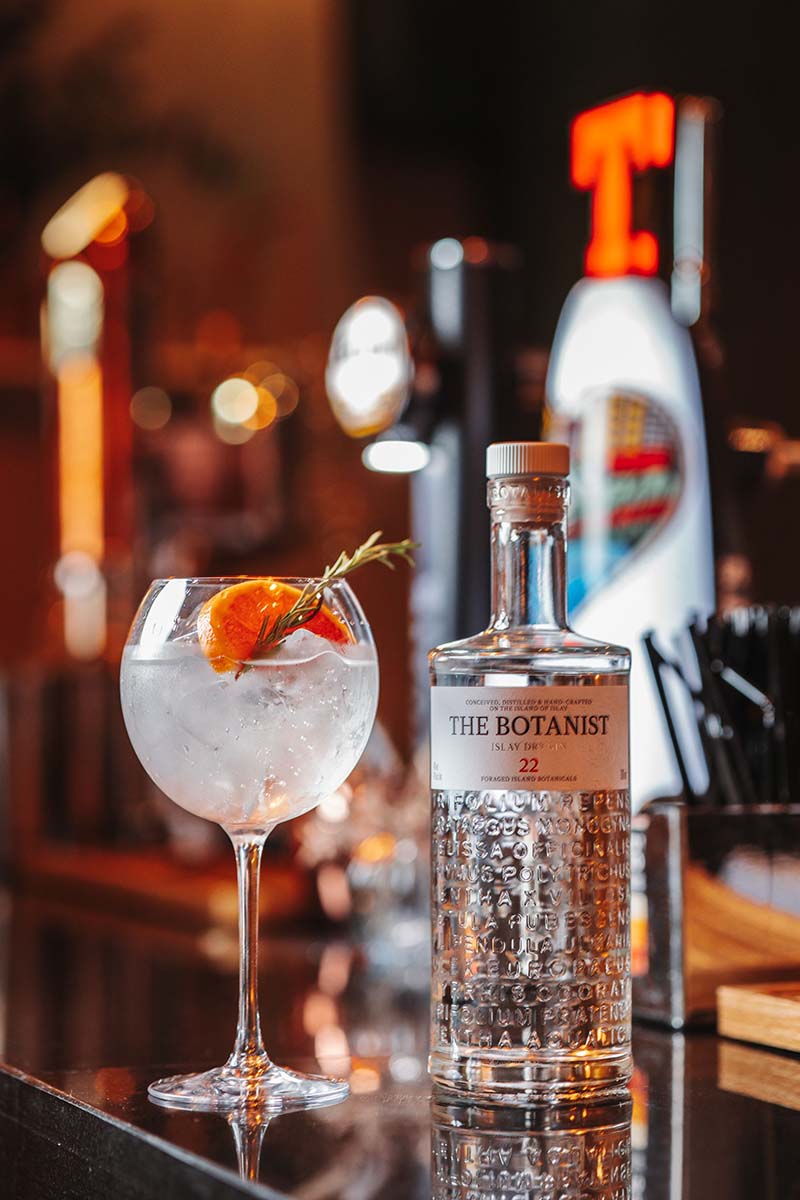 The botanist bottle with gin glass